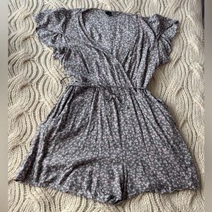 A girls size small romper. This is perfect for a summer day. Very lightweight.